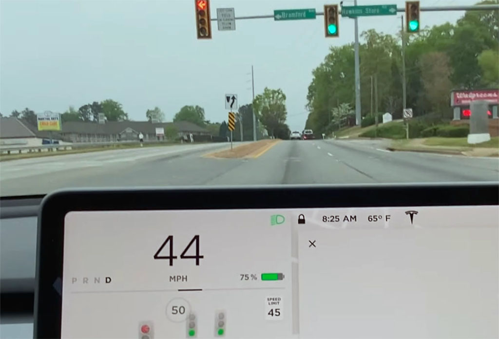 How can Tesla improve traffic light and stop sign control?